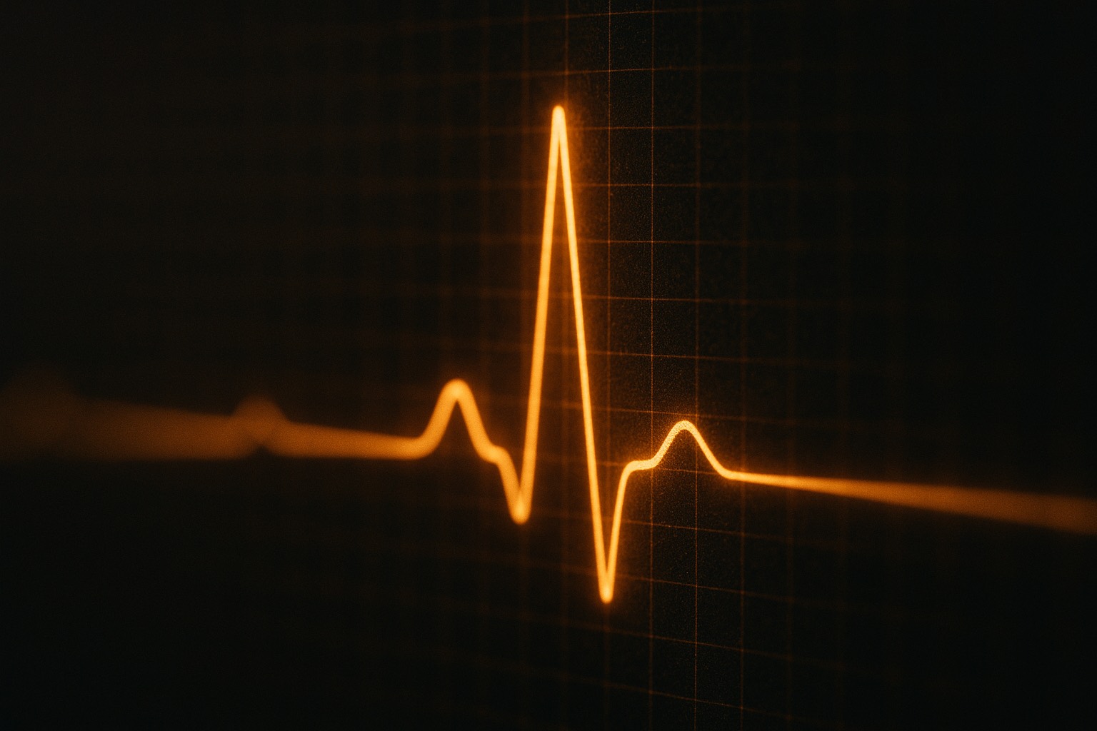 A glowing heartbeat line crossing a dark medical monitor.